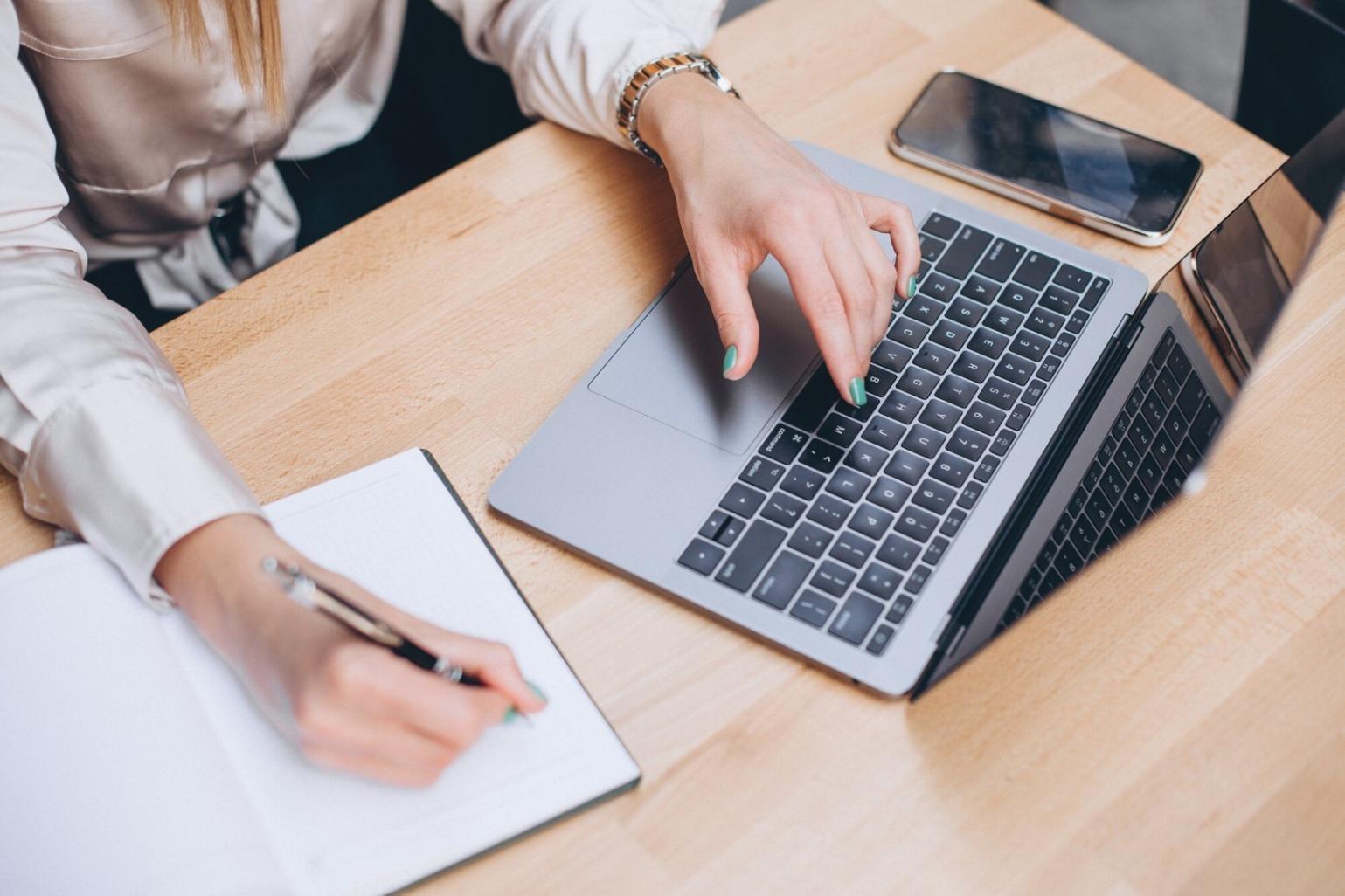 Close-up view of financial analysis documents with charts, graphs, and planning notes