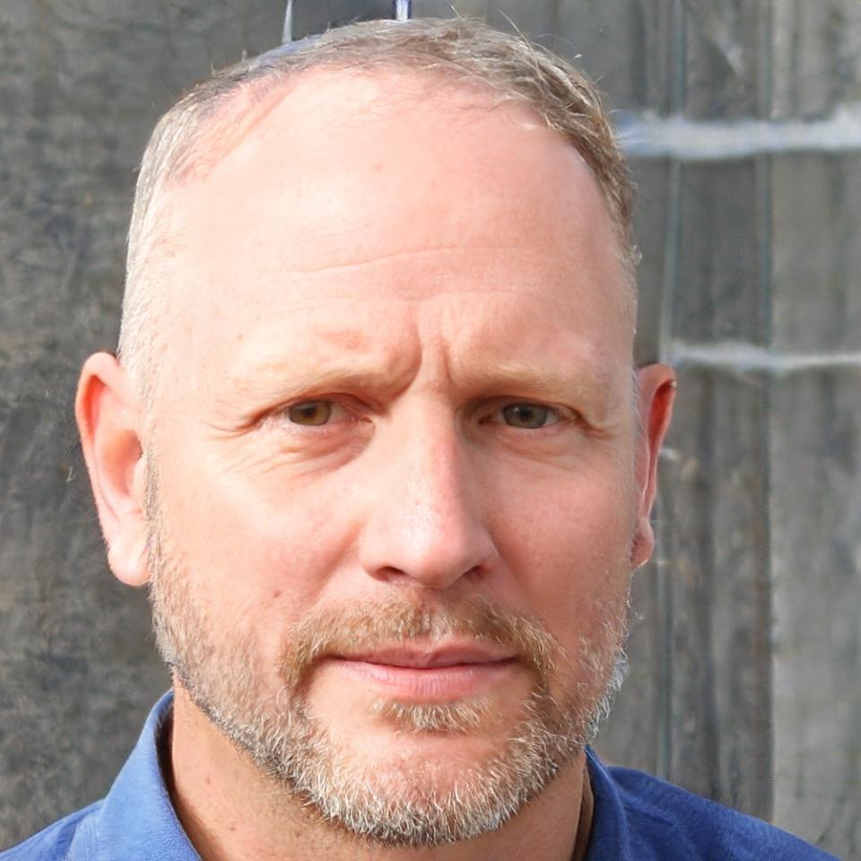 Professional headshot of successful business owner